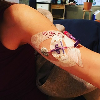 Arm with picc line inserted covered in bandages