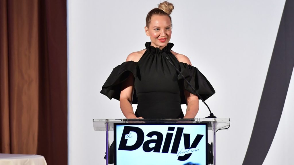 Sia at a podium - Courtesy Getty Images